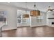 Sunlit living room with stylish pendant lights, hardwood floors, and fireplace at 6739 Encore Blvd, Atlanta, GA 30328