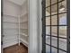 Walk-in pantry with custom shelving and an adjacent outdoor living space at 6739 Encore Blvd, Atlanta, GA 30328