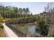 View of the pond, walking path, and lavish landscaping in this neighborhood at 6739 Encore Blvd, Atlanta, GA 30328