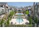 Community pools surrounded by patio seating, lush landscaping, and well-appointed residences at 6739 Encore Blvd, Atlanta, GA 30328