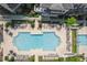 Aerial view of a community pool with lounge chairs, surrounded by upscale homes and manicured greenery at 6739 Encore Blvd, Atlanta, GA 30328