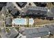 Aerial view features two community pools with lounge areas and landscaping, framed by luxurious residential buildings at 6739 Encore Blvd, Atlanta, GA 30328