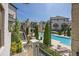 Elevated view of a well-maintained community pool, landscaped grounds, and multi-story residential buildings at 6739 Encore Blvd, Atlanta, GA 30328