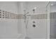 This bathroom features a luxurious shower with white subway tile and a rain shower head at 6739 Encore Blvd, Atlanta, GA 30328