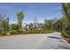 Scenic street view featuring well-maintained community landscaping and attractive residential buildings at 6739 Encore Blvd, Atlanta, GA 30328