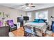 Comfortable bedroom with ceiling fan, window for natural light, and furniture at 9224 Snipe Ln, Jonesboro, GA 30236