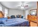 Cozy bedroom with hardwood floors, natural light, and classic wooden furniture at 9224 Snipe Ln, Jonesboro, GA 30236