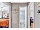 This is a view of the hallway, connecting the bedrooms and a bathroom, offering a sense of space and flow at 9224 Snipe Ln, Jonesboro, GA 30236