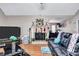 Inviting living room with hardwood floors, a cozy fireplace with holiday decorations, and comfortable seating at 9224 Snipe Ln, Jonesboro, GA 30236