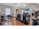 The open-concept living room offers plenty of seating, hardwood floors and a ceiling fan at 9224 Snipe Ln, Jonesboro, GA 30236