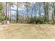 Large backyard featuring trees and space, excellent for outdoor activities and relaxation at 3390 Somerset Sw Trl, Atlanta, GA 30331