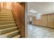 Partially finished basement with paneled walls and tiled flooring at 3390 Somerset Sw Trl, Atlanta, GA 30331