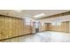 Partially finished basement with paneled walls, drop ceiling and multiple windows at 3390 Somerset Sw Trl, Atlanta, GA 30331