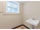 Small bathroom featuring a traditional sink and window with natural light at 3390 Somerset Sw Trl, Atlanta, GA 30331