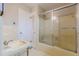 Bathroom with a sink, tub and shower combo, and a white door at 3390 Somerset Sw Trl, Atlanta, GA 30331