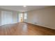 Large bedroom with two closets, hardwood floors and view to the bathroom at 3390 Somerset Sw Trl, Atlanta, GA 30331