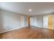 Bedroom with hardwood floors and view to the bathroom and closet at 3390 Somerset Sw Trl, Atlanta, GA 30331