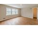 Empty bedroom boasting hardwood floors and large windows offering plenty of natural light at 3390 Somerset Sw Trl, Atlanta, GA 30331