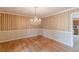 Elegant dining room with a chandelier and access to the kitchen at 3390 Somerset Sw Trl, Atlanta, GA 30331