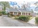 Attractive brick home with well-manicured landscaping and paved driveway, creating a welcoming entrance at 3390 Somerset Sw Trl, Atlanta, GA 30331