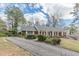 Charming brick home with mature trees and a long driveway, providing great curb appeal at 3390 Somerset Sw Trl, Atlanta, GA 30331
