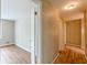 Hallway with wallpaper, wood floors, and doorway leading to the next room at 3390 Somerset Sw Trl, Atlanta, GA 30331