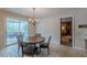 Kitchen with dining area, chandelier and door to screened in porch at 3390 Somerset Sw Trl, Atlanta, GA 30331