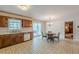 Eat-in kitchen with wood cabinets, tile floors, and chandelier at 3390 Somerset Sw Trl, Atlanta, GA 30331