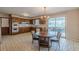 Kitchen with dining area, oak cabinets and door to screened in porch at 3390 Somerset Sw Trl, Atlanta, GA 30331