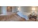 Large living room showcasing hardwood floors and access to another room with a chandelier at 3390 Somerset Sw Trl, Atlanta, GA 30331