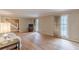 Spacious living room with hardwood floors, large windows, and staircase access at 3390 Somerset Sw Trl, Atlanta, GA 30331