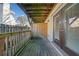 Outdoor patio with wooden deck, railing, and glass doors to the home's interior at 48 Peachtree Ne Ave # 412, Atlanta, GA 30305
