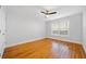 A light-filled bedroom features hardwood floors and a modern ceiling fan at 48 Peachtree Ne Ave # 412, Atlanta, GA 30305