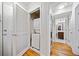 Hallway with Washer/Dryer and a doorway to a Bathroom at 48 Peachtree Ne Ave # 412, Atlanta, GA 30305