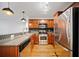 Kitchen with stainless steel appliances, wood cabinets, and granite countertops at 48 Peachtree Ne Ave # 412, Atlanta, GA 30305