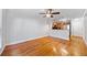 Open living room with hardwood floors flowing into kitchen with stainless steel appliances at 48 Peachtree Ne Ave # 412, Atlanta, GA 30305
