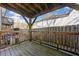 Outdoor patio with wooden deck, railing, and covered overhead structure at 48 Peachtree Ne Ave # 412, Atlanta, GA 30305