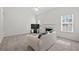 Inviting living room with fireplace, plush carpet, and lots of natural light at 6450 Wellington Chase Ct, Lithonia, GA 30058