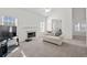 Bright, neutral living room with fireplace, plush carpet, and lots of natural light at 6450 Wellington Chase Ct, Lithonia, GA 30058