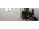 Bright office space featuring a desk and chair, next to a room with carpet and light, airy ambiance at 6450 Wellington Chase Ct, Lithonia, GA 30058