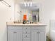 Bathroom featuring a double sink vanity, bathtub, and modern lighting at 174 Whetstone Way, Villa Rica, GA 30180