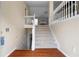 Inviting entryway with wood floors and staircase leading to the upper level of the home at 174 Whetstone Way, Villa Rica, GA 30180