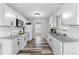Modern kitchen featuring granite countertops, white cabinets, and stainless steel appliances at 174 Whetstone Way, Villa Rica, GA 30180