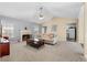 Bright and open living room featuring a fireplace, vaulted ceilings, and comfortable furnishings at 174 Whetstone Way, Villa Rica, GA 30180
