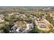 Aerial shot of a residential area featuring townhomes and office buildings amongst trees, providing a serene environment at 407 The Crossings Ln, Woodstock, GA 30189