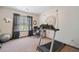 Bedroom with carpet, large window, treadmill and space for a desk or other exercise equipment at 407 The Crossings Ln, Woodstock, GA 30189