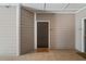 Apartment entryway with tile floors and a tan welcome mat at 407 The Crossings Ln, Woodstock, GA 30189