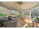 Community gazebo with seating and views of the surrounding buildings and green space at 407 The Crossings Ln, Woodstock, GA 30189