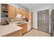 Functional kitchen with ample counter space, tiled backsplash, and modern appliances at 407 The Crossings Ln, Woodstock, GA 30189