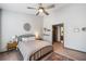 Inviting main bedroom with a ceiling fan and en-suite bathroom at 407 The Crossings Ln, Woodstock, GA 30189